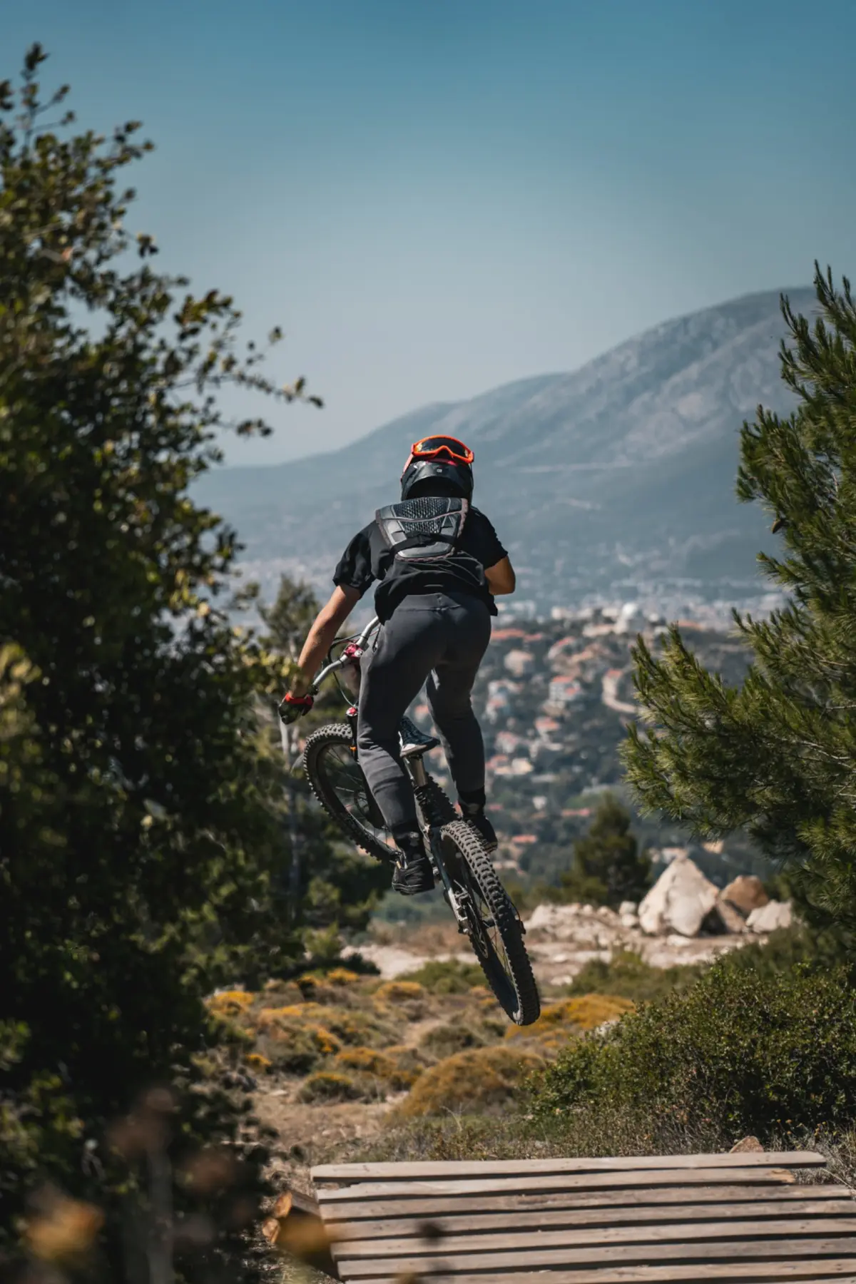 Downhill mountain bike rider above Penteli